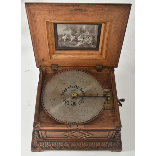 280 - Nicole Freres - A 19th century Swiss carved oak Polyphon disc music box. The box having a metal plaq... 