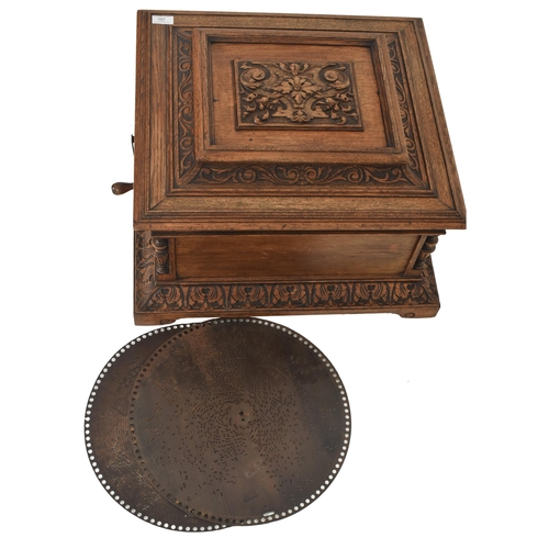 280 - Nicole Freres - A 19th century Swiss carved oak Polyphon disc music box. The box having a metal plaq... 