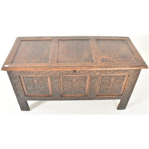 283 - An early 18th century carved oak blanket box / mule chest. The coffer having a three panelled hinged... 