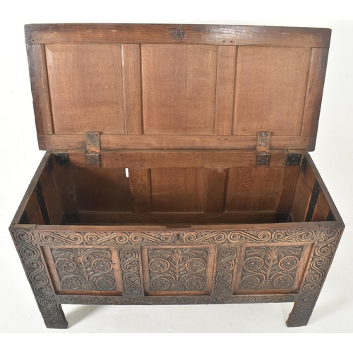 283 - An early 18th century carved oak blanket box / mule chest. The coffer having a three panelled hinged... 