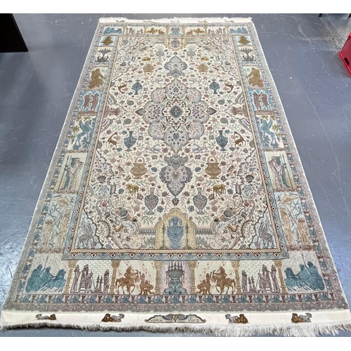 284 - A Persian Tabriz Zir Khaki hand woven wool & silk 60 raj floor carpet rug. The carpet having a c... 