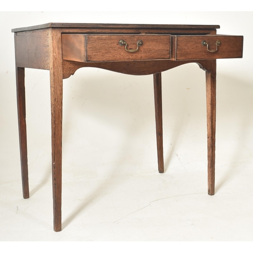 288 - A George III early 19th century oak two drawer writing table desk. The table having a straight recta... 