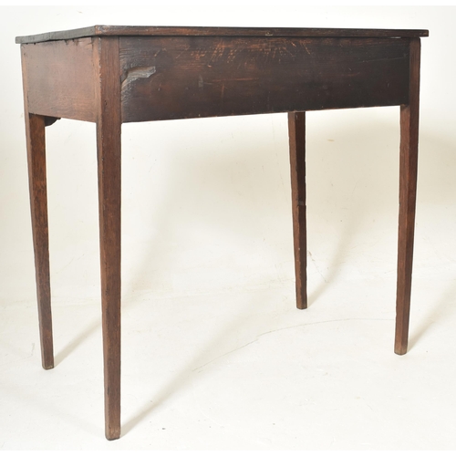 288 - A George III early 19th century oak two drawer writing table desk. The table having a straight recta... 