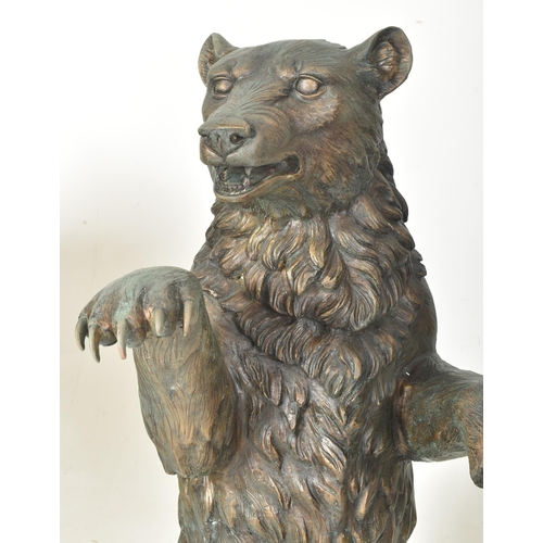 291 - A Black Forest manner early 20th century hollow cast bronze floor standing figure of bear. The bear ... 