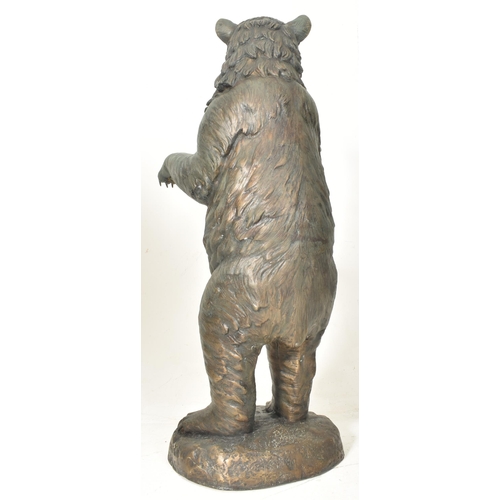 291 - A Black Forest manner early 20th century hollow cast bronze floor standing figure of bear. The bear ... 