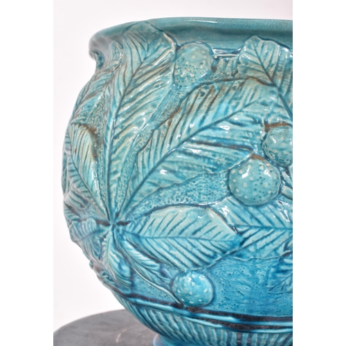 294 - Burmantofts Faience & Bretby, England - a 19th century green-blue glazed ceramic floor planter j... 