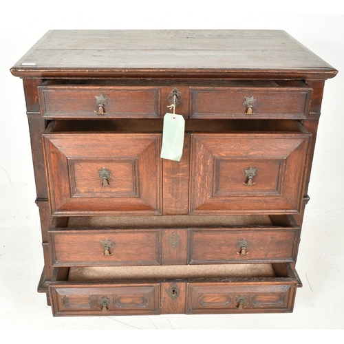 295 - A 17th century Commonwealth block fronted oak chest of drawers. The chest having a rectangular flare... 