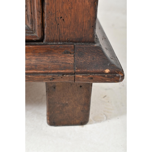 295 - A 17th century Commonwealth block fronted oak chest of drawers. The chest having a rectangular flare... 