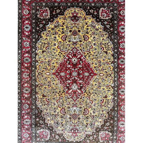 301 - A Persian Ghom Province 100% silk floor carpet rug. The carpet having a central yellow & red flo... 