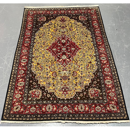 301 - A Persian Ghom Province 100% silk floor carpet rug. The carpet having a central yellow & red flo... 