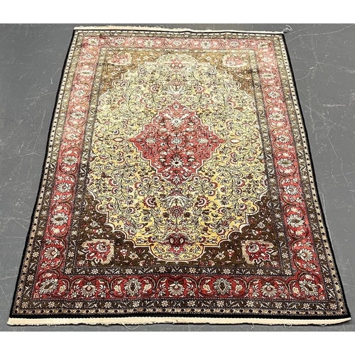 301 - A Persian Ghom Province 100% silk floor carpet rug. The carpet having a central yellow & red flo... 