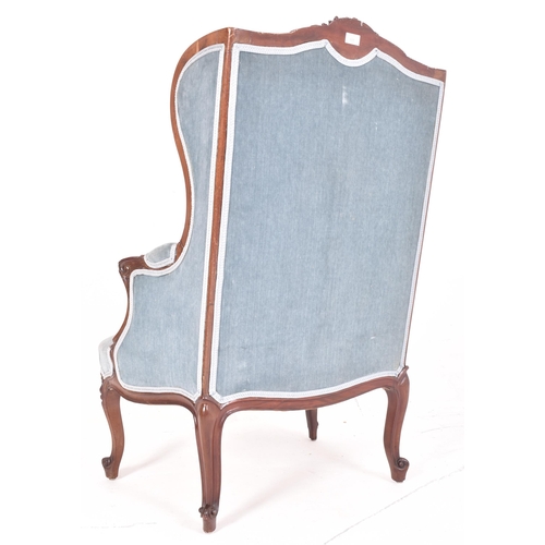 305 - A Victorian 19th century mahogany framed & velvet upholstered wingback armchair. The armchair ha... 