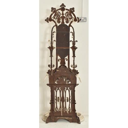 306 - A Victorian 19th century Coalbrookdale manner white painted cast iron hall umbrella stand. The stand... 