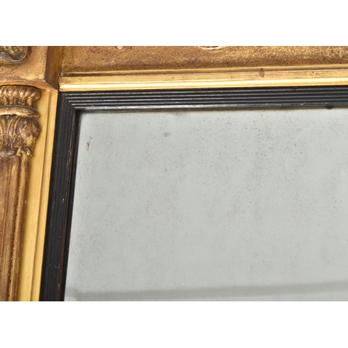 308 - A Regency early 19th century gilt wood & gesso worked overmantel mirror. The mirror having a fla... 