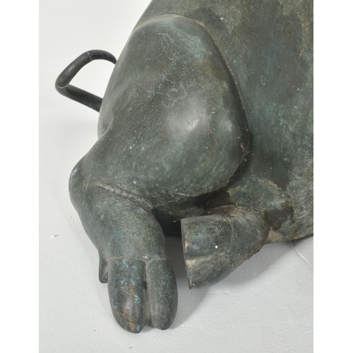 310 - A large late 20th century cast bronze worked floor standing pig statue sculpture. The pig shown seat... 