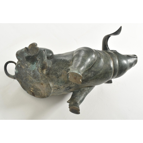 310 - A large late 20th century cast bronze worked floor standing pig statue sculpture. The pig shown seat... 