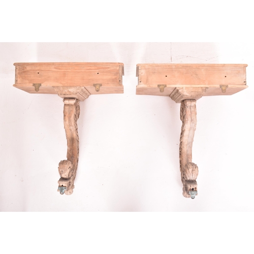 311 - A pair of continental Rococo inspired carved stripped wood wall console hall tables. Each monopedic ... 