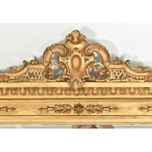 314 - A Victorian 19th century gilt wood & gesso worked overmantel mirror. The mirror having an intric... 