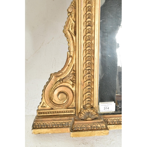 314 - A Victorian 19th century gilt wood & gesso worked overmantel mirror. The mirror having an intric... 