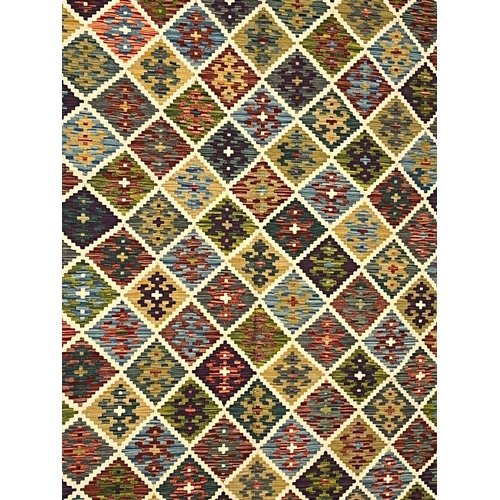 316 - A 20th century Anatolian Turkish Islamic Kilim floor carpet rug. The rug having a central panel with... 