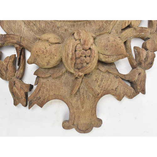 319 - A continental Black Forest early 20th century carved oak wall hanging clock. The clock having a deer... 