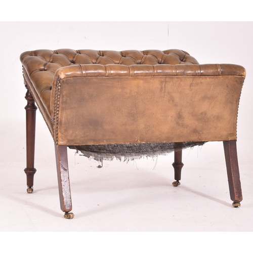 320 - A 19th century leather Chesterfield buttoned foot stool. The stool of mahogany construction with but... 