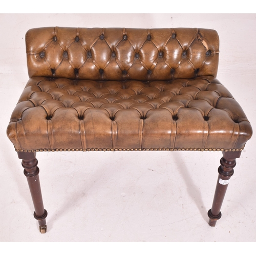 320 - A 19th century leather Chesterfield buttoned foot stool. The stool of mahogany construction with but... 