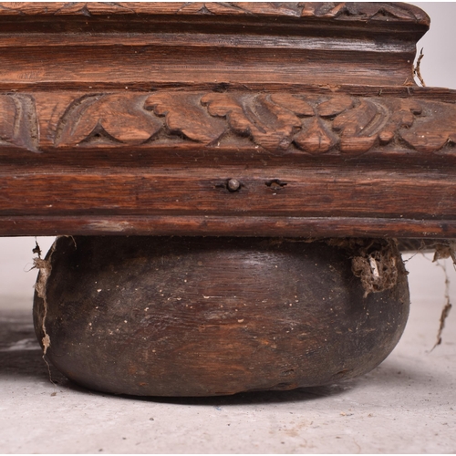 326 - A 19th century carved oak library bookcase cabinet. The bookcase having a twin door glazed top with ... 