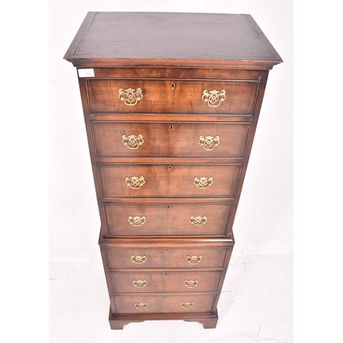 332 - A Queen Anne revival walnut bachelors chest on chest of drawers / tallboy. The seminaire chest havin... 