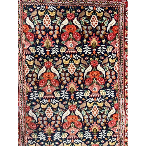 334 - A Persian Kashan pictorial wool floor carpet runner rug. The runner rug having a central cobalt blue... 