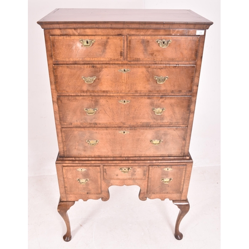 339 - A Queen Anne George III crossbanded flame mahogany chest of drawers on stand - tallboy. The chest ha... 