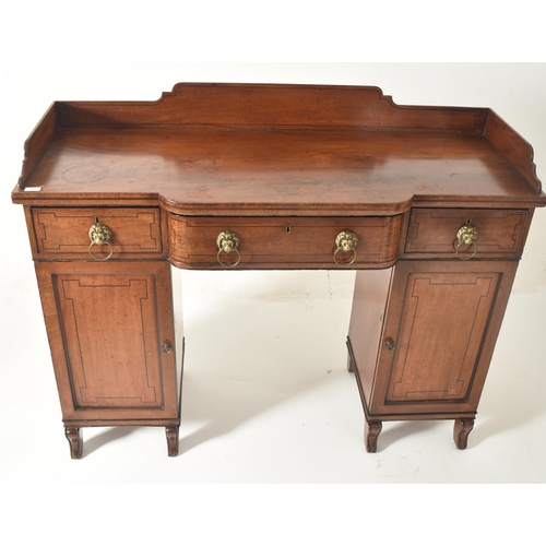 342 - A George III early 19th century mahogany breakfront pedestal writing desk table. The desk having a s... 