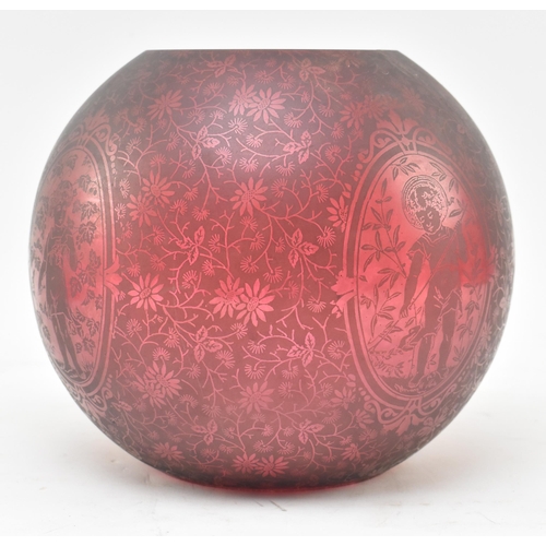 344 - A Victorian 19th century cranberry / ruby red glass acid etched bulbous oil lamp light shade. The sh... 