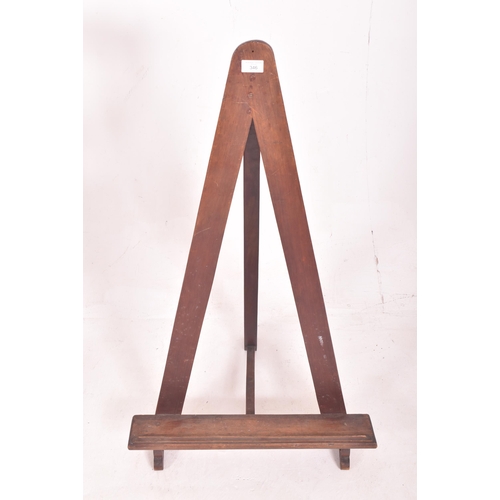 346 - An early 20th century mahogany & pine fixed floor artist's easel stand. The easel having a trian... 