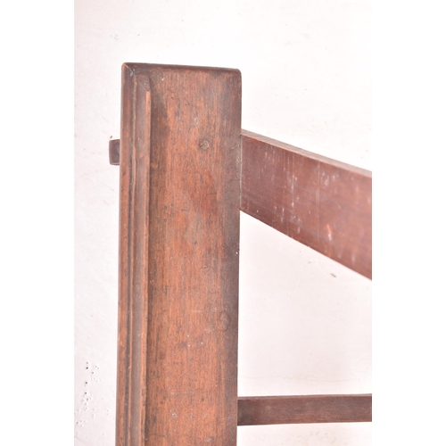 346 - An early 20th century mahogany & pine fixed floor artist's easel stand. The easel having a trian... 