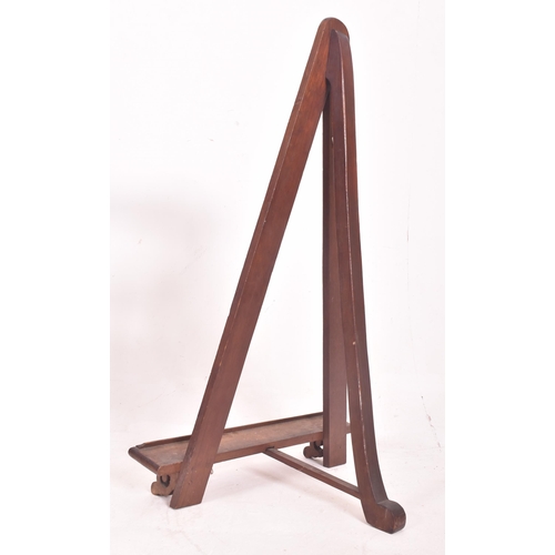 346 - An early 20th century mahogany & pine fixed floor artist's easel stand. The easel having a trian... 