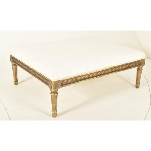 348 - A 19th century Victorian gilt wood ottoman footstool. The ottoman upholstered with cream silk uphols... 