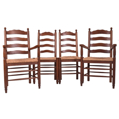 353 - A matching set of eight 20th century oak and rush seated North Country ladderback dining chairs. Eac... 