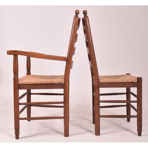 353 - A matching set of eight 20th century oak and rush seated North Country ladderback dining chairs. Eac... 