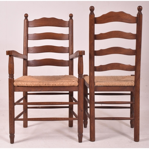 353 - A matching set of eight 20th century oak and rush seated North Country ladderback dining chairs. Eac... 