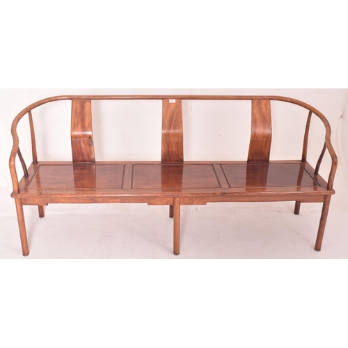 355 - A three piece suite of Chinese Huanghuali wood horseshoe three seater bench and pair of armchairs. E... 