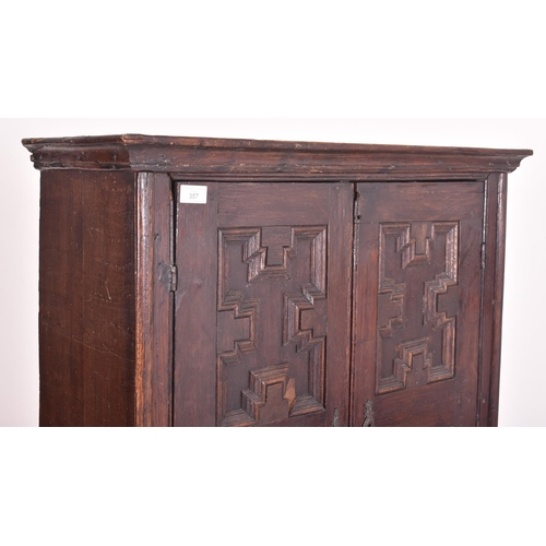 357 - A Jacobean Revival 19th century oak estate cupboard / bookcase cabinet on stand. The cabinet having ... 