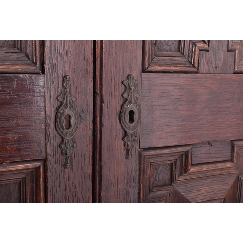 357 - A Jacobean Revival 19th century oak estate cupboard / bookcase cabinet on stand. The cabinet having ... 