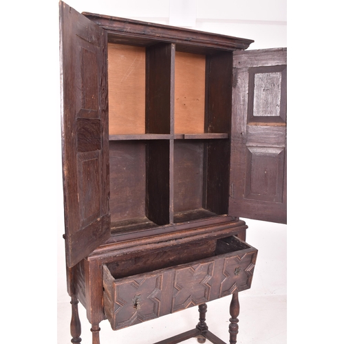 357 - A Jacobean Revival 19th century oak estate cupboard / bookcase cabinet on stand. The cabinet having ... 