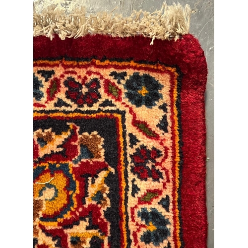 358 - A 20th century Central Persian Islamic Kashan floor carpet runner rug. The runner having a central r... 