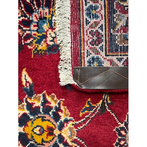 358 - A 20th century Central Persian Islamic Kashan floor carpet runner rug. The runner having a central r... 