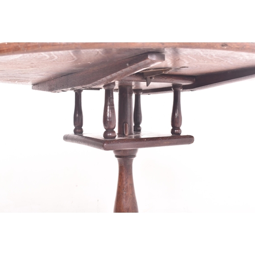 374 - A George III 18th century oak birdcage mechanism tilt top tripod loo table. The table having a circu... 