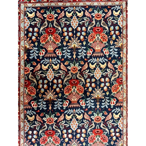 375 - A Persian Kashan pictorial wool floor carpet runner rug. The runner rug having a central cobalt blue... 