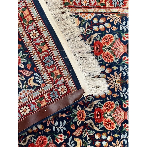 375 - A Persian Kashan pictorial wool floor carpet runner rug. The runner rug having a central cobalt blue... 