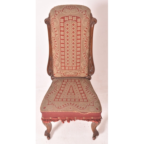 377 - A 19th century carved mahogany & tapestry needlepoint upholstery nursing chair. The chair having... 